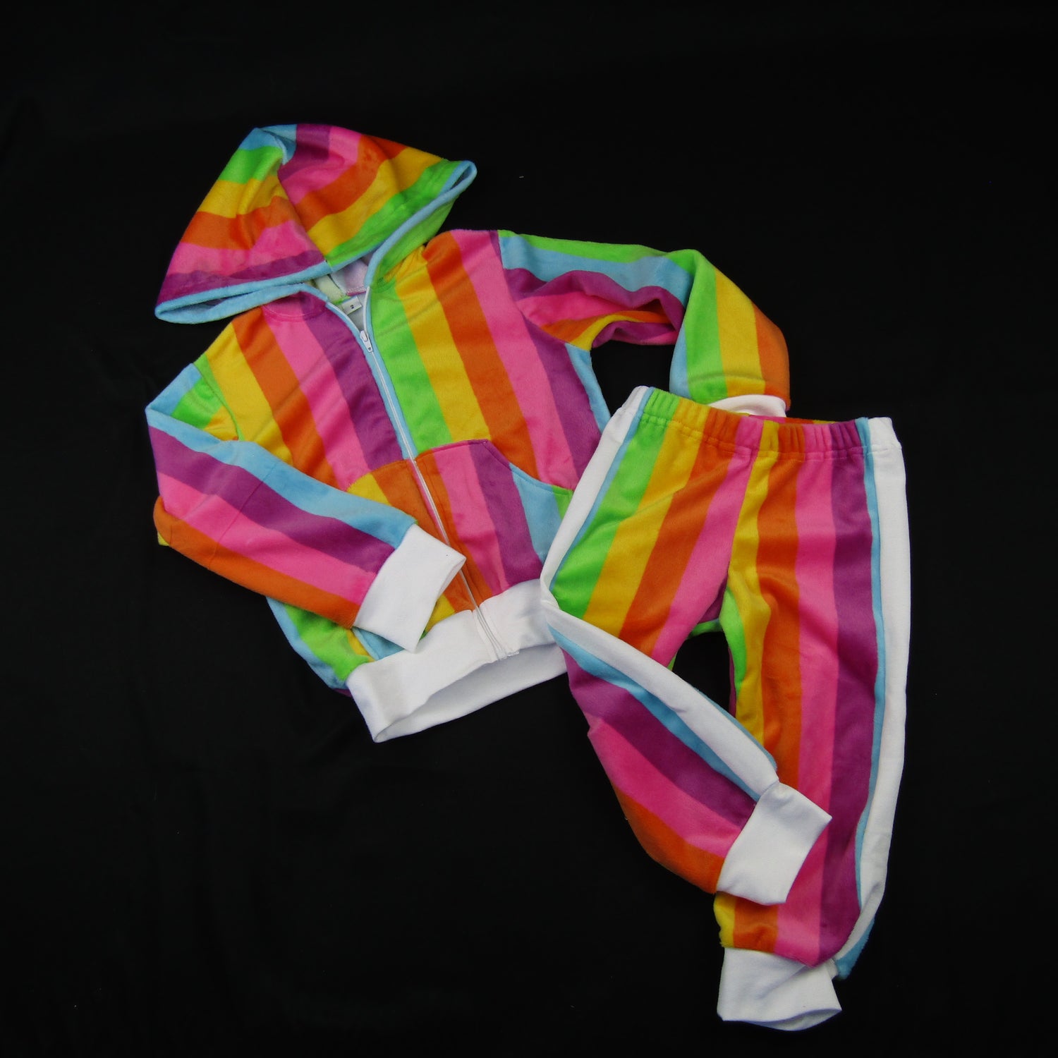 Velvety Jogging suit with hooded jacket and pants. Rainbow stripes and pants with white side stripe.